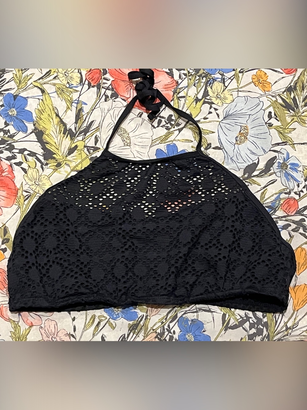 Woman’s black high neck crochet style halter bikini top
